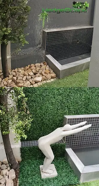 Garden service-area screen: A compact hedge panel screens a low service or utility area beside stones, pipes and garden edging.