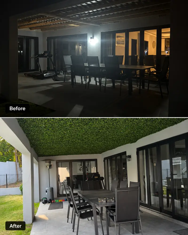 Covered patio ceiling before and after: A dark overhead structure is lined with artificial greenery above the dining and entertainment area.